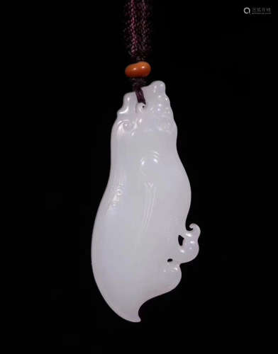 A HETIAN JADE MONSTER PENDANT