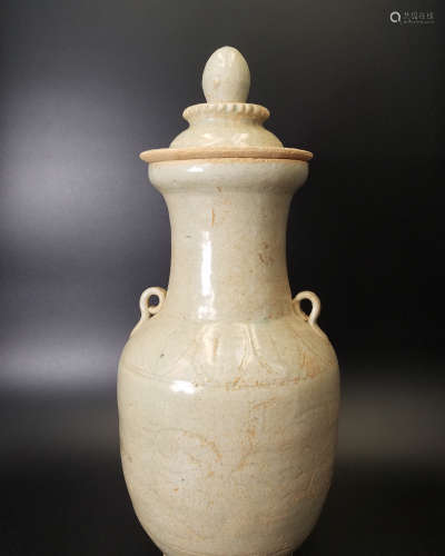 A CELADON-GLAZED JAR WITH COVER