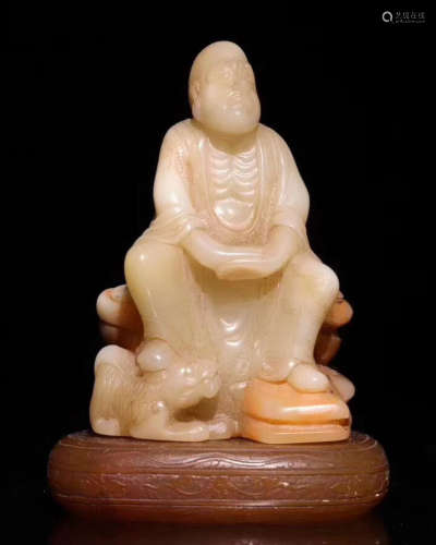 A SOAPSTONE MONK FIGURE