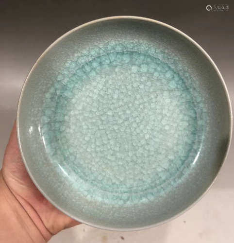 A LIGHT BLUE GLAZED PLATE