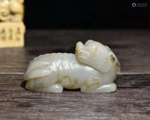 A HETIAN JADE MONSTER SHAPED PAPER WEIGHT