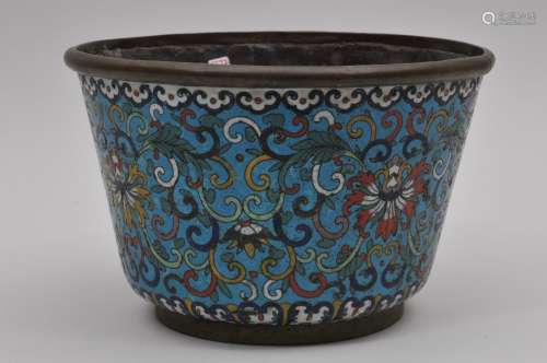 Cloisonné bowl. China. 19th century. Stylized lotus scrolling on a turquoise ground. Ch'ien Lung mark on the base. 8-1/2