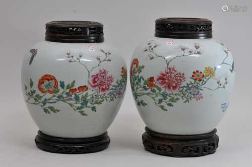 Pair of porcelain vases. China. 18th century. Globular form. Famille Rose decoration of birds and flowers. 8-1/2