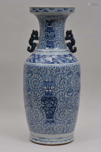 Porcelain vase. China. 19th century. Baluster form with kuei dragon handles. Underglaze blue decoration of 