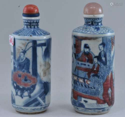 Lot of two Snuff bottles. China. 19th century. Cylindrical form. Underglaze blue and red decoration  historical scenes. 3-1/2