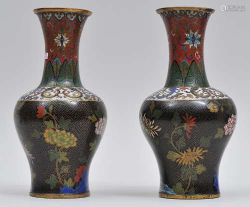 Pair of Cloisonne vases. China. Early 19th century. Decoration of flowers on a black thunder meander ground. Dragons on the shoulder. Acanthus leaves at the neck. 9-3/4