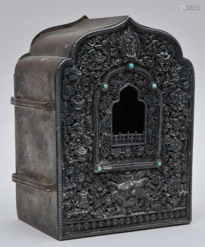 Portable shrine. Tibet. 19th century. Kau of repousse silver and copper inset with turquoise. Composite character at the back. 7-1/4