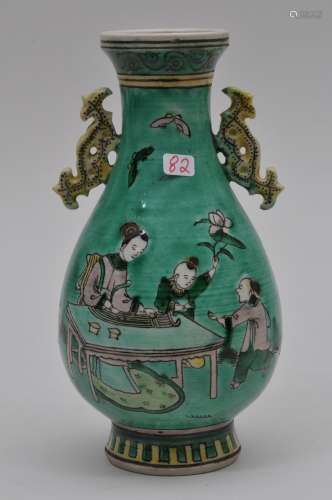 San Tsai on biscuit vase. China. Early 20th century. Stylized dragon handles. Scene of women and playing children. Marked China. 6-7/8