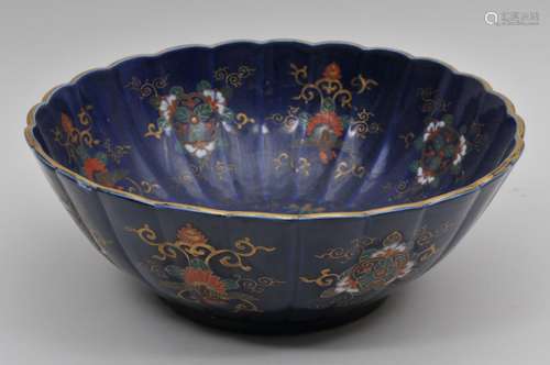 Imari bowl. Meiji period (1868-1912). Lobated form. Blue ground decorated with phoenix and floral patterns. Signed Koransha. 12-1/2