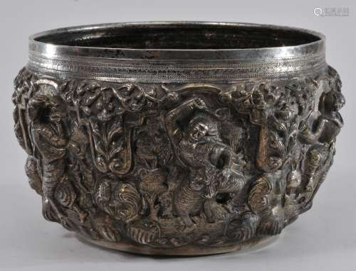 Burmese silver bowl. Early 20th century. High relief repousse silver with figures and flowers. Signed on the base. 47.6 troy ounces.