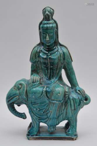 Stoneware Buddhist Image of Manjushri seated on the back of an elephant. Turquoise glaze. 14-1/2