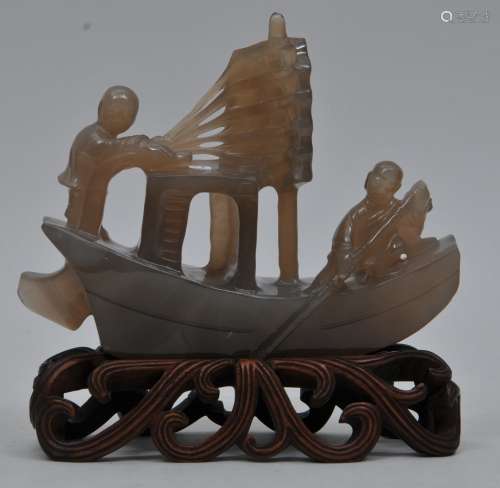 Agate carving. China. Early 20th century. Boat under sail with two sailors and a dog. Fitted stand. 7-1/2