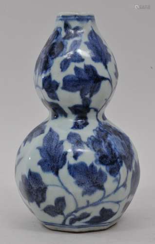 Porcelain vase. China. 20th century. Octagonal double gourd form. Underglaze blue floral decoration. 7-1/2