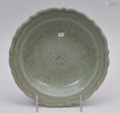 Celadon dish. China. Ming period. (1368-1644). Foliate edge interior carved with floral scrolling. 8-3/8