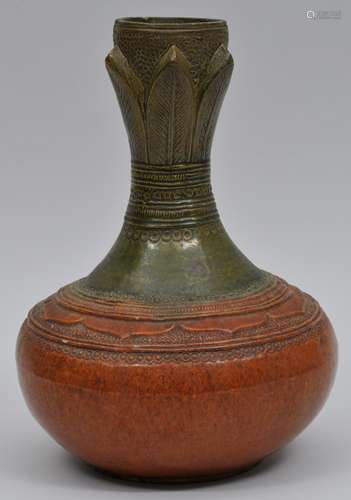 Pottery vase. South East Asia. 18th century or earlier. Olive green and amber glaze of a decoration of carved leaves on a punched ground. 10