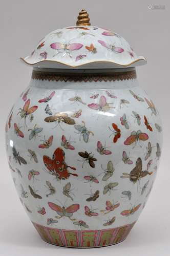 Large covered jar. China. Kuang Hsu mark and possibly of the period. Oviform shape with a lotus leaf lid and shell finial. Decoration of 