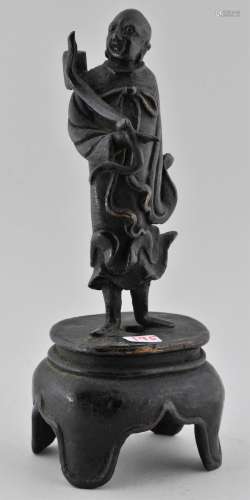 Bronze candle pricket. China. Ming period (1368-1644). Figure of a standing Immortal. 6-1/2