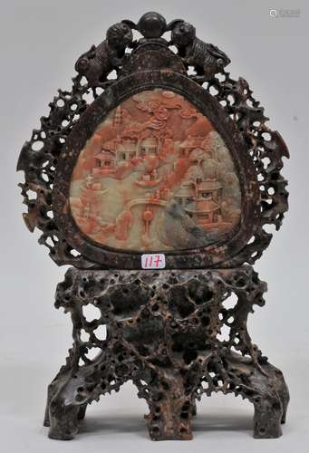 Table screen. China. 19th century. Purple soapstone carved with branches and foo dogs enclosing a pink and white soapstone reserve of a landscape. 9