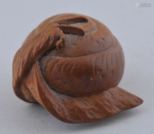 Wooden Netsuke. Japan. 19th century. Study of a snail. Signed Masatomo. 1-1/4