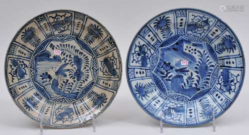 Two porcelain plates. Japan. 17th century. Kraak style decoration of insects and flowers with floral borders in underglaze blue. Kin (gold) mark on the base. Each about 8-1/2