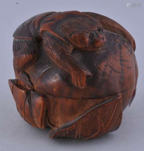 Carved box. Meiji period (1868-1912). Boxwood. Carving of a monkey with a persimon. 2-1/2 