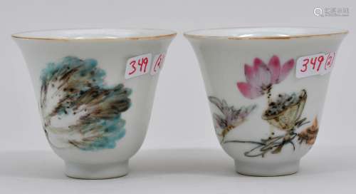 Pair of porcelain cups. China. Early 20th century. Famille Rose decoration of lotus, cabbage and butterflies. 2-3/8
