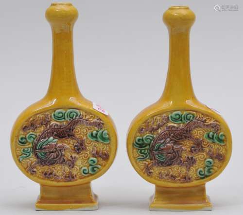 Pair of porcelain vases. China. Early 20th century. Moon flask shape with long necks and 