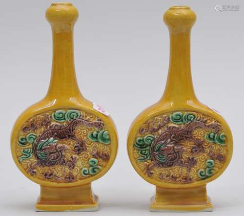 Pair of porcelain vases. China. Early 20th century. Moon flask shape with long necks and 