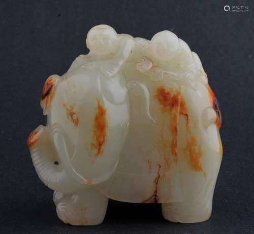 Jade carving. China. 18th century. Litchee white stone with pronounced russet markings. Carved as two children with a caperisoned elephant. 2-3/4