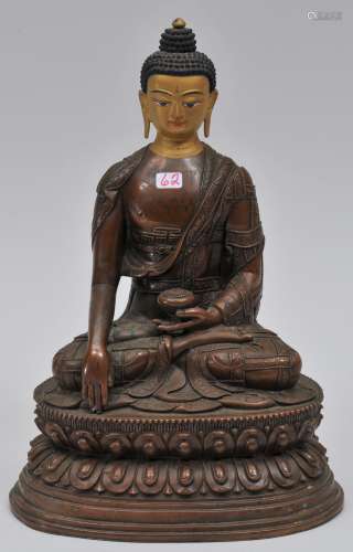 Bronze Buddha. Tibet. 19th century. Seated figure of Amida in the earth witnessing mudra. Ornately chased robes. Cold gold paste face. Long inscription on the reverse. 9