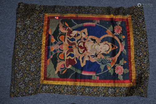 Embroidered thangkha. China or Tibet. Early 20th century. Seated figure of Tara. 28