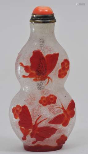Snuff bottle. China. 19th century. Overlay glass. Double gourd form. Cameo cut from red to snowflake with butterflies and flowers. 2-5/8