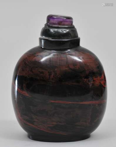 Snuff bottle. China. 19th century. Realgar glass. Amethyst and silver stopper. 2-1/4