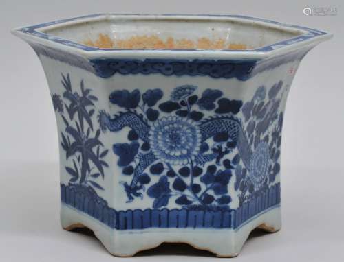 Porcleain planter. China. 19th century. Hexagonal form. Underglaze blue decoration of dragon and flowers. 8-1/4