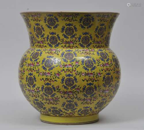 Large porcelain vase. China. 20th century. Golbular body with a slightly flaring mouth. Yellow ground decorated with Shou medallions, bats and peaches. Tung Chih mark on the base. 18