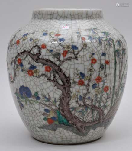 Porcelain vase. China. Late 19th to early 20th century. Famille Verte enamel decoration of The Three Friends: Pine, Prunus and Bamboo on a crackled ground. Ovoid shape. Four character K'ang Hsi mark on the base. 9-1/2