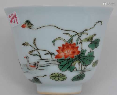 Porcelain wine cup. China. 20th century. Decoration of mandarin ducks and lotus plants. K'ang Hsi mark. 2