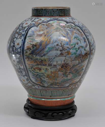 Porcelain jar. Japan. Early 18th century. Kutani ware. Ovoid form. Decoration of panels of landscapes with floral borders in underglaze blue, enamels and gilt. 12-1/2