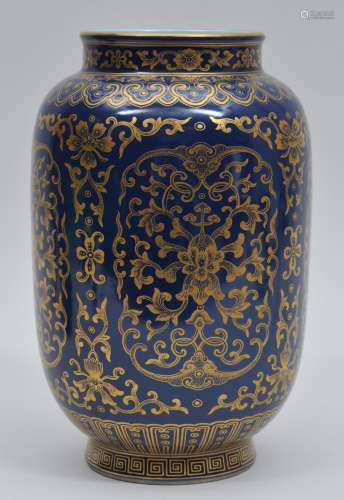 Porcelain vase. China. 20th century. Blue glaze with decoration of floral scrolling in gold. 10