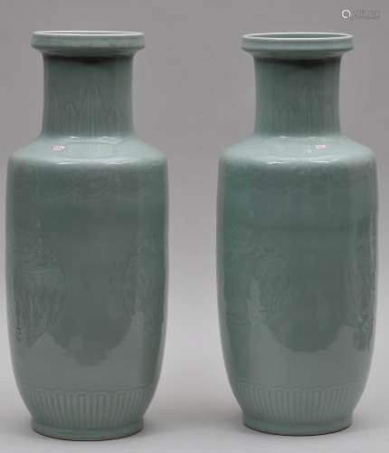 Pair of porcelain vases. China. 19th century. Roleau shape. Carved decoration of crane roundels. Celadon green glaze. Drilled as lamps. 18