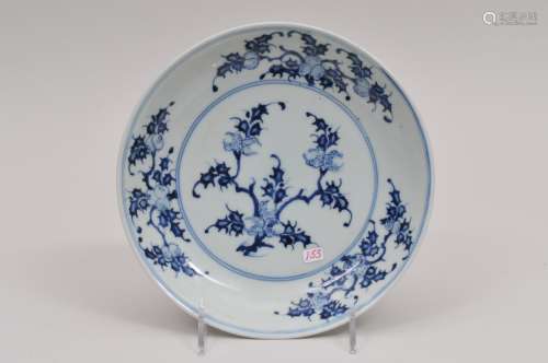 Porcelain saucer dish. China. 18th century. Underglaze blue decoration of the San Duo (Three fruits). Shop mark on the base. 7-3/4