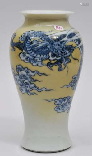 Porcelain vase. Japan. Meiji period. (1868-1912). Underglaze blue decoration of a dragon and  clouds on a ground of yellow fading to white. Signed. 7-1/4