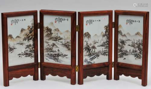 Four porcelain plaques. China. Republican period. Circa 1930. Sepia decoration of landscapes. Hardwood frame. 25-1/2