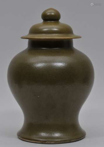Covered jar. China. 19th century. Baluster form. Tea dust glaze. Ch'ien Lung mark on the base. 12