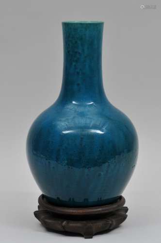 Porcelain vase. China. 19th century. Bottle form. Dark turquoise glaze. 12-1/2