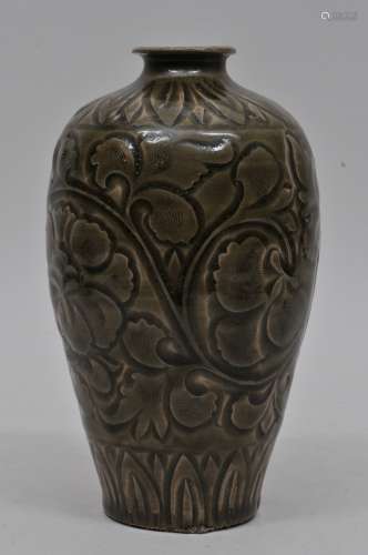 Stoneware vase. China. 20th century. Yao Chou style. Surface carved with floral scrolling. Dark celadon green glaze. 7-1/2