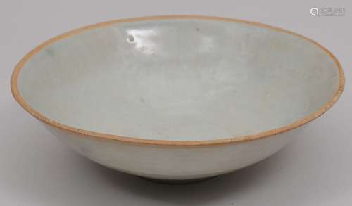 Porcelain bowl. China. 13th-14th century. Ching Pai ware. Decoration of moulded lotus flowers. Pale celadon glaze. 7-3/4