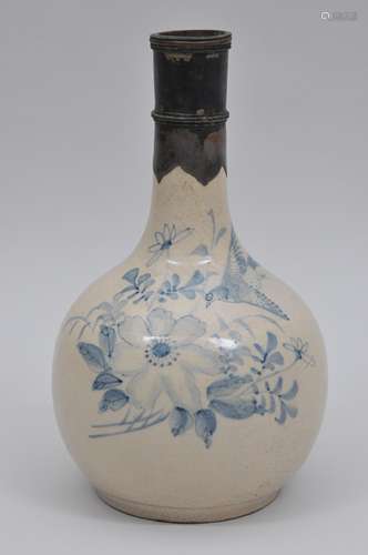 Pottery bottle. China. 19th century. Underglaze blue decoration of birds and flowers. Silver and copper mounted neck. Probably Indonesian. 10