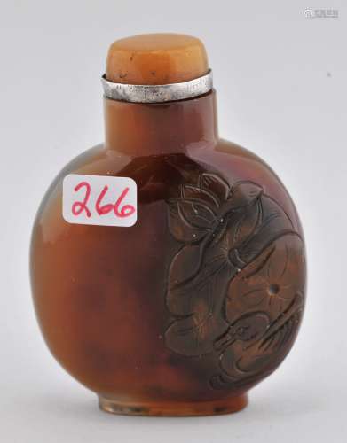 Agate Snuff bottle. China. 19th century. Surfaces carved with mandarin ducks and lotus plants. 2-1/4