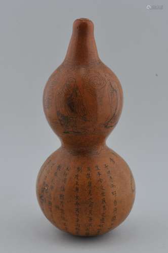 Double gourd. China. Early 20th century. Surface engraved with Buddhist saints and a long inscription. Hallmark on the base. 6